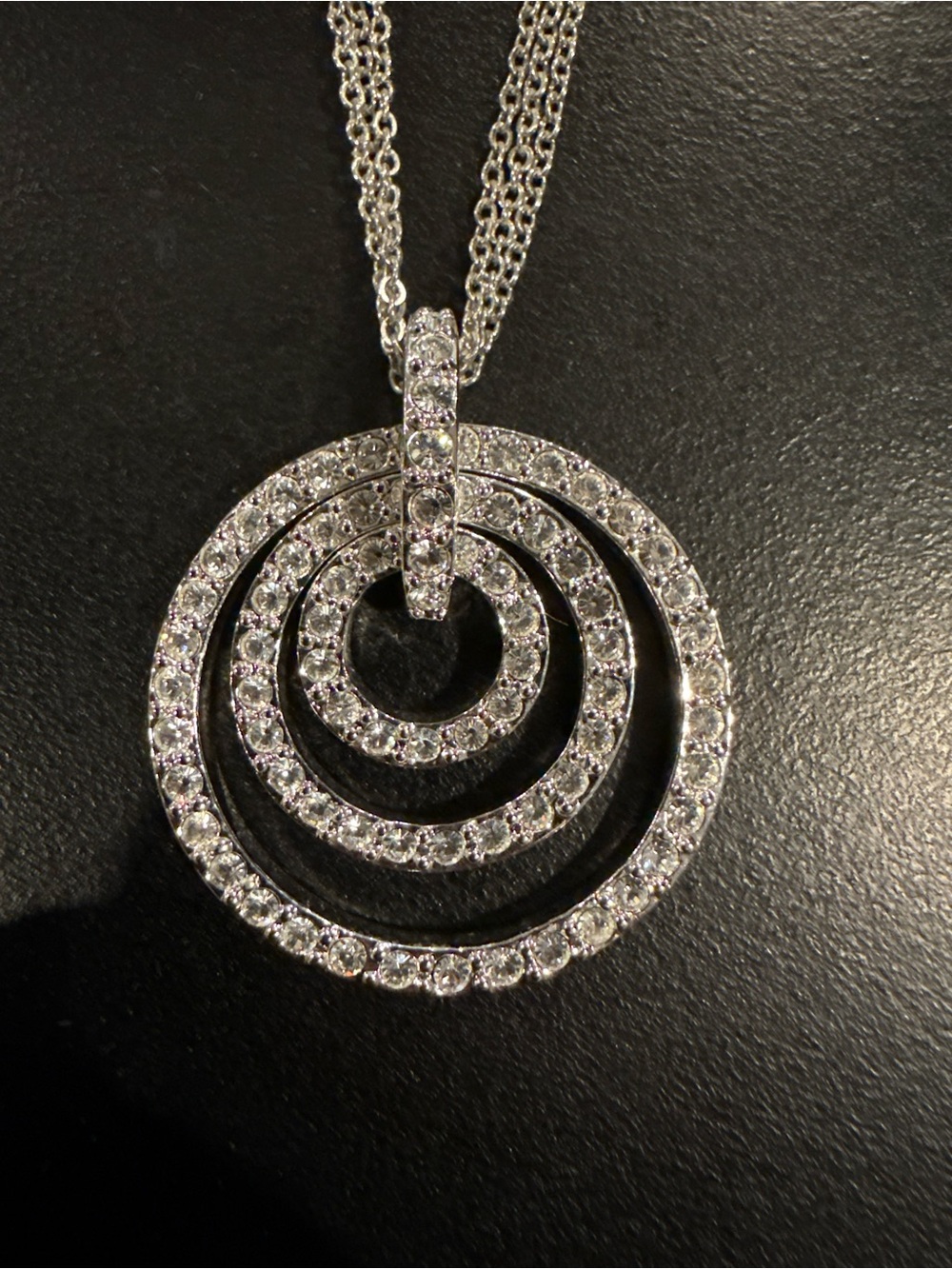 Nolan Miller Triple Circle Pendant Necklace Authentic 3-strand silvertone chain.